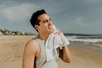 Man relaxing after workout on the beach