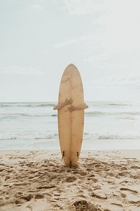 Surfer hugging a surfboard mockup