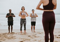 Yogis enjoying a yoga session on the beach