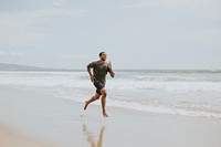 Black man running on the beach