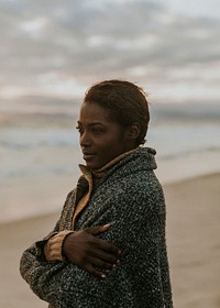 Black woman on the beach at sunset