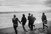 Friends running on the beach