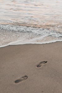 Footstep by the seashore in the summer