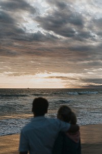 Young couple hugging at the beach