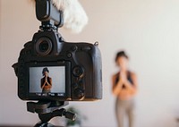 Yogini filming herself at a studio
