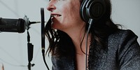 Female radio host broadcasting live in a studio
