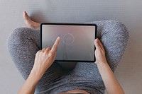 Yoga instructor using a digital tablet mobile phone wallpaper