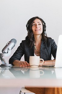 Female radio host broadcasting live in a studio