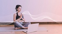 Active woman learning a yoga online via a laptop