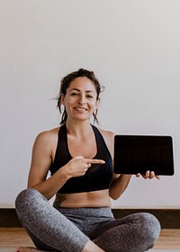Yoga instructor showing a digital tablet mobile phone wallpaper