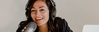 Female radio host broadcasting live in a studio