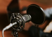 Condense microphone with a pop filter in a studio