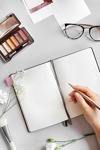 Woman writing on a notebook