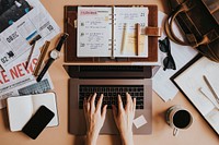 Woman at her desk using a laptop