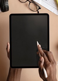 Black woman using a digital tablet mockup