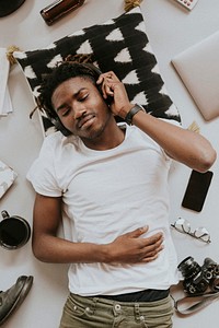 African American man listening to music on his headphones