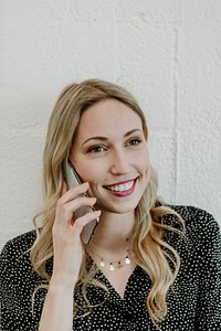 Happy woman talking on the phone