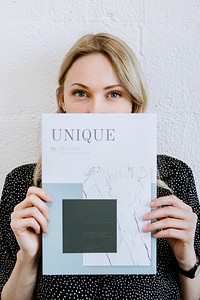 Woman holding a unique magazine