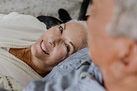 Cheerful elderly couple in a bed