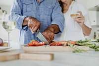 Elderly couple cooking in a kitchen