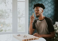 A man holding weed in hand