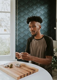 A man rolling a joint