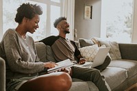 Cheerful black people using a laptop