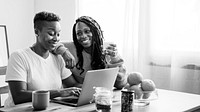 Happy gay couple having breakfast