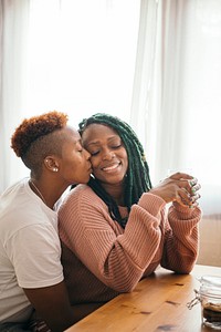 Romantic lesbian couple drinking milk