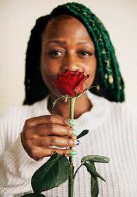 Happy black woman supporting gay rights with red rose