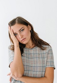 Stressed woman wearing a plaid t-shirt