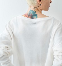 Tattooed woman wearing a white t-shirt mockup
