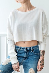 Cool tattooed woman in a white top