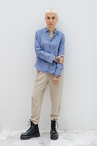 Cool blond hair woman in a blue linen shirt