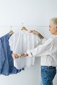 Woman looking at a white shirt