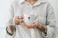 Tattooed woman with a cup of coffee mockup