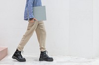 Casual woman carrying a portfolio