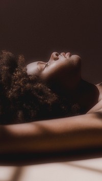 Shadows over a sensual black woman mobile phone wallpaper