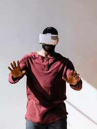 Black man experiencing virtual reality with VR headset
