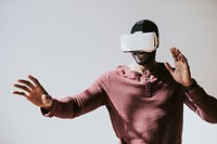 Black man experiencing virtual reality with VR headset