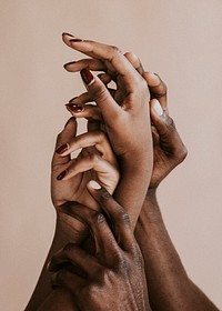 Black hands on a beige background