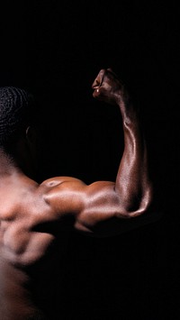 Rear view of muscular black man mobile phone wallpaper