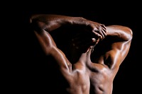 Black man stretching his back muscles