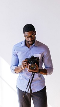 Black photographer using a retro film camera mobile phone wallpaper