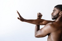 Naked black man warming up before exercise