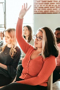 Cheerful woman speaking in a workshop