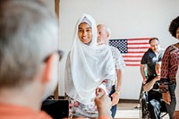 American Muslim queuing at a polling place
