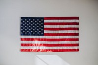 US flag on a white wall