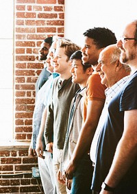Cheerful diverse men standing in a row