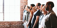 Cheerful diverse men standing in a row